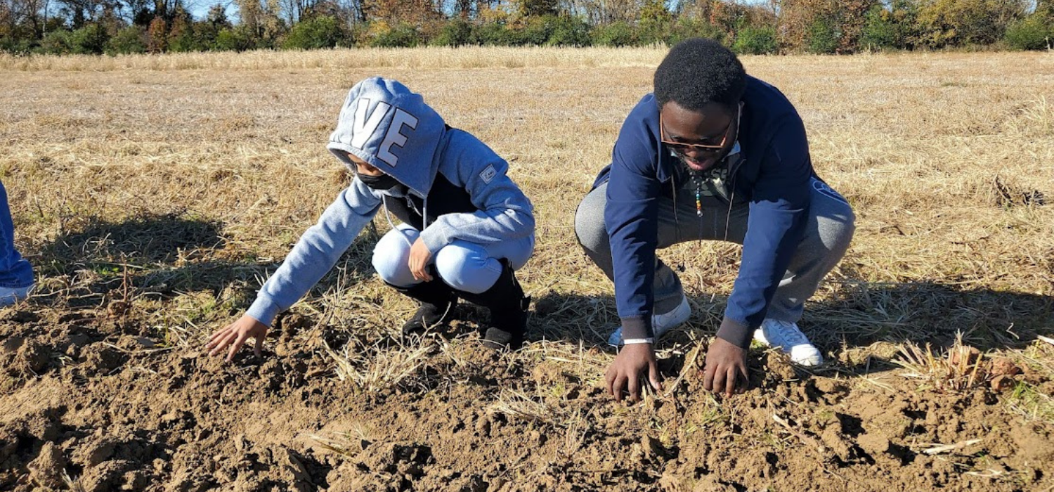 Students working dirt in Agri-STEM program. 